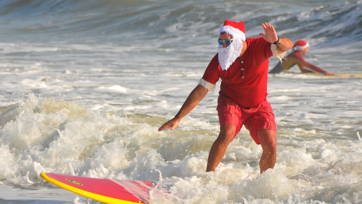 635550235878840433 Cocoa Beach Surfing Santa 58.JPG?width=1200