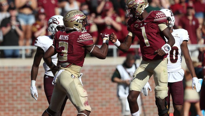 FSU's Cam Akers celebrates his touchdown with James Blackman during their game against Louisiana Monroe at Doak Campbell Stadium on Saturday, Dec. 1, 2017.