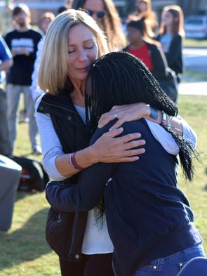 Makayla Smith (right) hugs Bianka Landavazo after unveiling