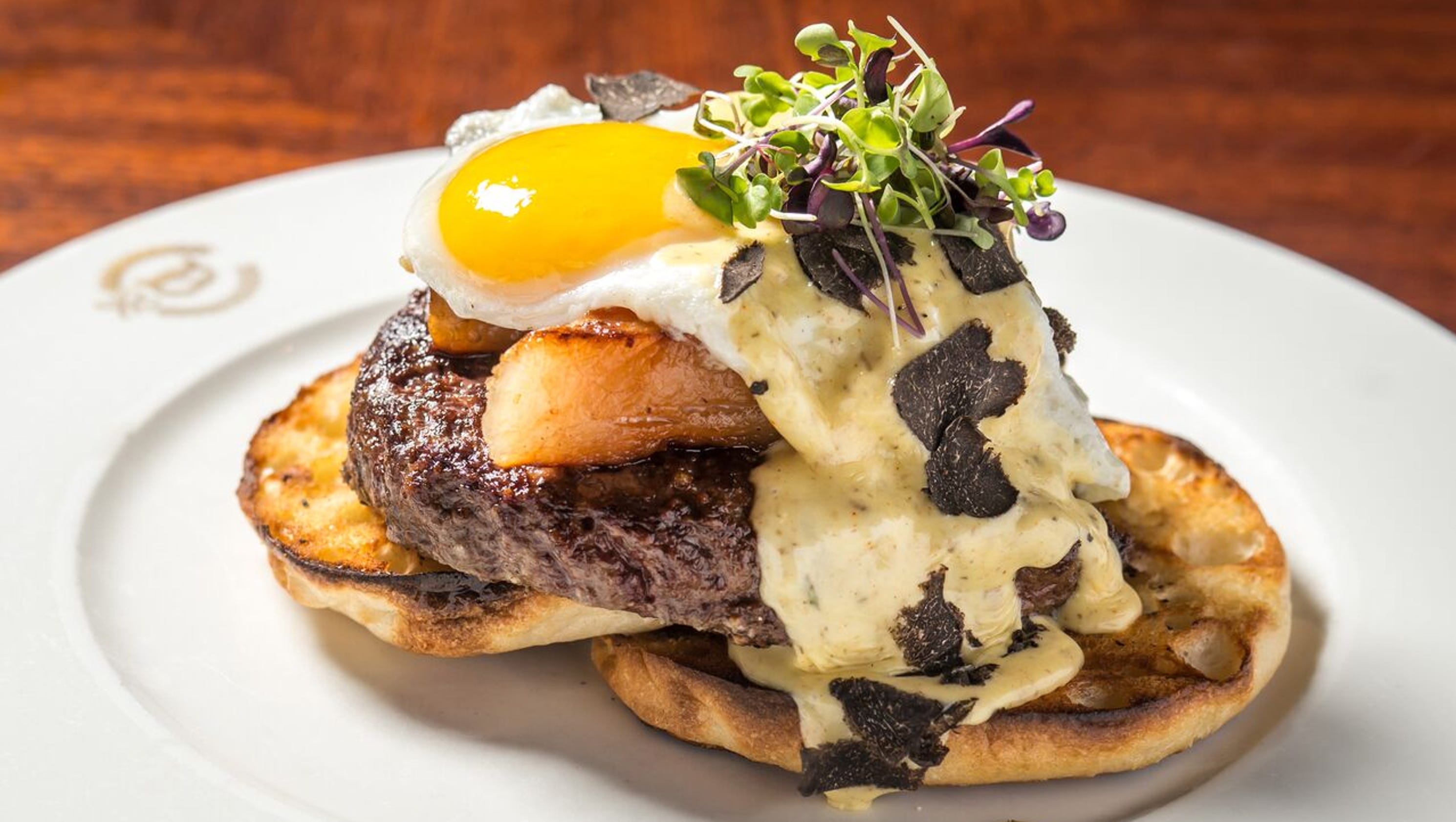 Eggs Benedict variations on brunch menus across the country