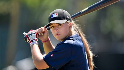 Melissa Mayeux holds the bat as she poses at a baseball camp in Paderborn, Germany, Wednesday, July 1, 2015. The 16-year-old player on the French U-18 junior national team, made history when she became the first woman on Major League Baseball's international registration list, making her eligible to be signed by Major League teams.