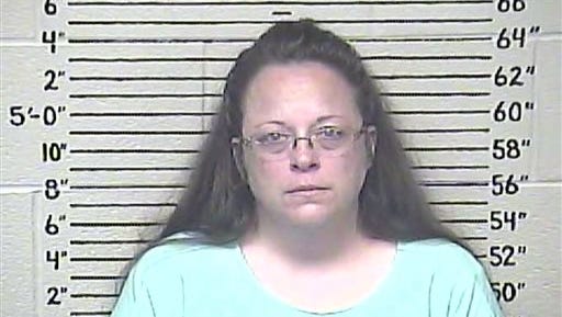 This Thursday, Aug. 3, 2015 photo made available by the Carter County Detention Center shows Kim Davis. The Rowan County, Ky. clerk went to jail Thursday for refusing to issue marriage licenses to gay couples, but five of her deputies agreed to comply with the law, ending a two-month standoff.