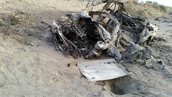 This photo purports to show the destroyed vehicle in which Mullah Mohammad Akhtar Mansour was traveling in the Ahmad Wal area in Baluchistan province of Pakistan, near Afghanistan's border. A senior commander of the Afghan Taliban confirmed Sunday that Mansour, the extremist group's leader,  was killed in a U.S. drone strike.