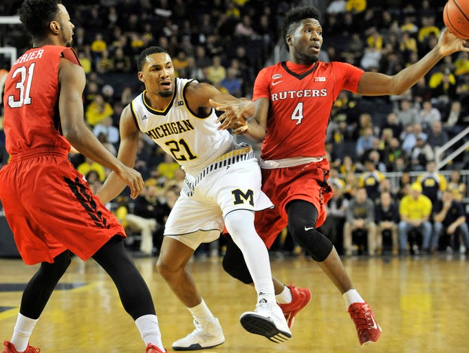 Rutgers forward Jonathan Laurent (4) knocks the ball