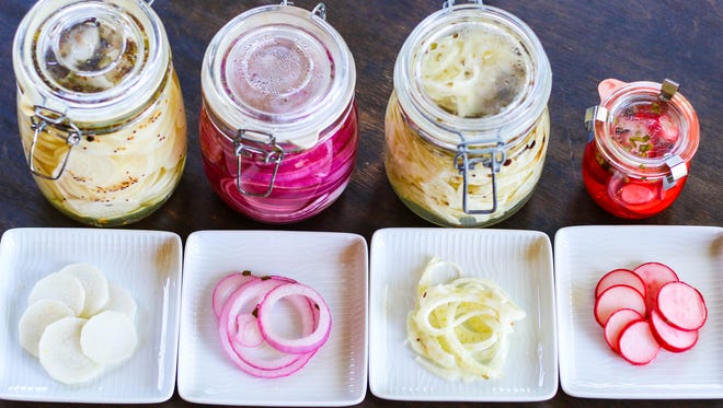 Four twists on refrigerator pickles: daikon, red onion, shaved fennel and radishes.