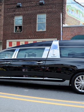 A large crowd gathered in downtown Black Mountain to say goodbye to the Rev. Billy Graham, who passed away at his Montreat home on Feb. 21. Graham's funeral procession, which took him to Charlotte, exited I-40 and made its way east on U.S. 70 through the center of town, just miles from his former home.