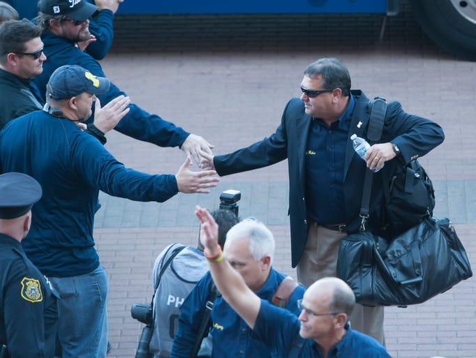Head coach Brady Hoke arrives at the stadium for the