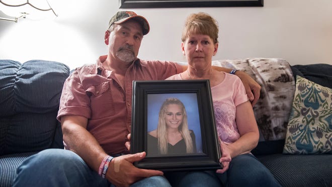 Rich and Shelia Craumer hold a portrait of their late daughter, Briana, inside their Spring Grove home. Briana battled a heroin addiction that claimed her life in December 2017. The Craumers have since started Bri’s Hope, a monthly support group for those affected by addiction. 