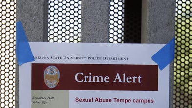 ASU posts signs at the Adelphi II Commons near Apache Boulevard and Rural in Tempe after an sexual assault occurred on Tuesday night, September 9, 2014.