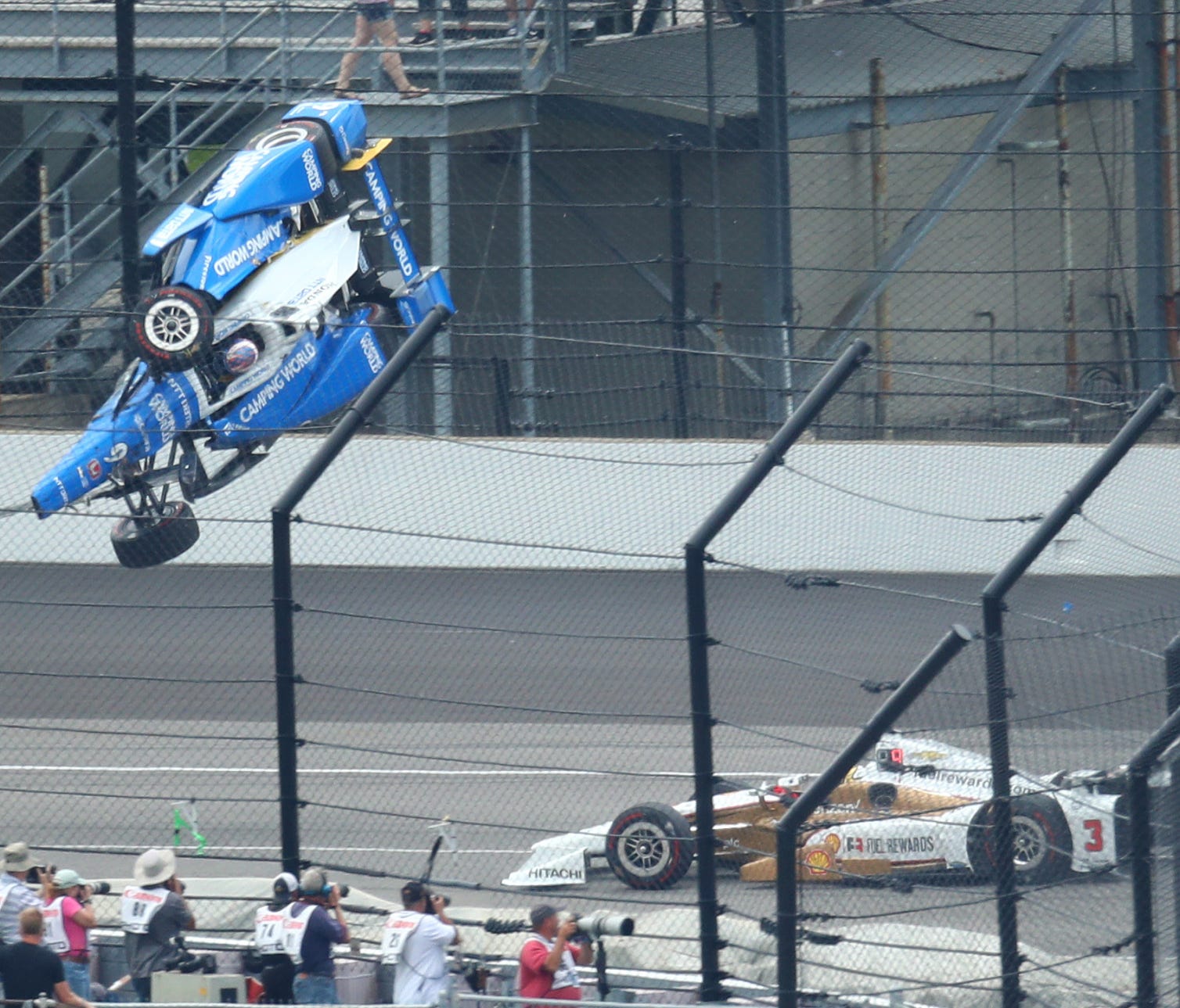 May 28, 2017; Indianapolis, IN, USA; IndyCar Series driver Scott Dixon (9) goes airborne and crashes in front of Helio Castroneves (3) during the 101st Running of the Indianapolis 500 at Indianapolis Motor Speedway. Mandatory Credit: Mark J. Rebilas-