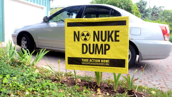 An anti nuke dump poster sits in a yard in Kincardine, Ontario.