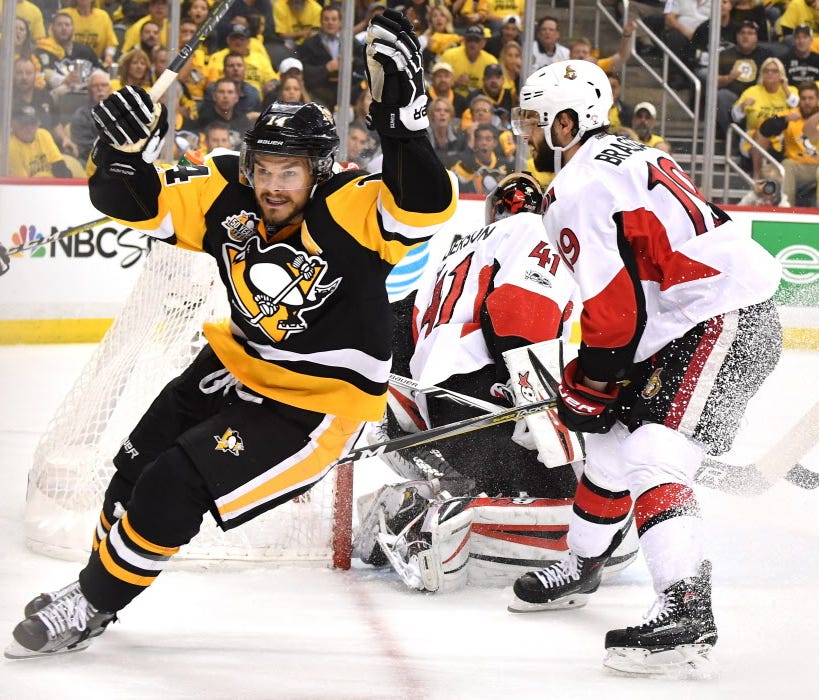 Chris Kunitz celebrates after scoring the game-winning goal in double overtime against the Ottawa Senators.