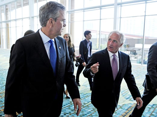 May 30, 2015: Former Florida Gov. Jeb Bush, left, enters
