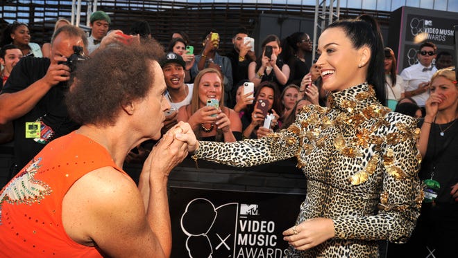 Richard Simmons kisses Katy Perry's hand on the 2013 MTV Video Music Awards red carpet at the Barclays Center on Sunday.