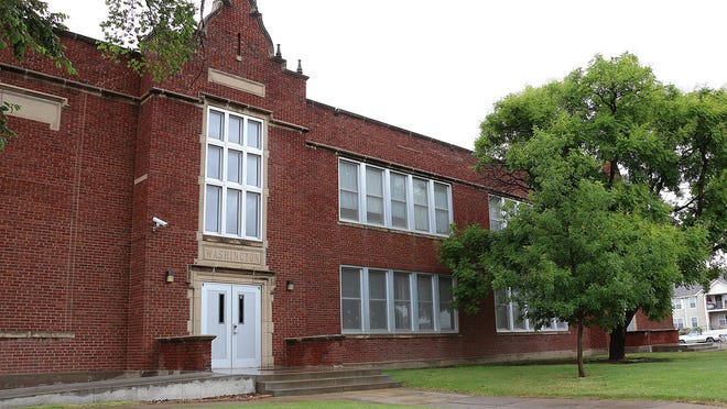 The USD 489 school board voted Monday to officially close Washington Elementary School. The closure of the school moves Overland Property Group one step closer to its goal of renovating the building into affordable housing apartments.