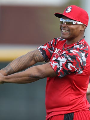 0 Reds outfielder Marlon Byrd, who was acquired in the offseason, stretches with other position players at Spring Training.
