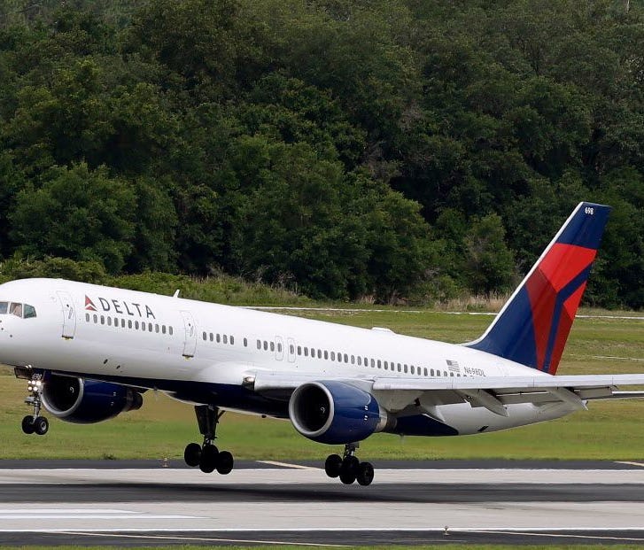 A Delta Air Lines Boeing 757-232 lands May 14, 2015, at Tampa International Airport.