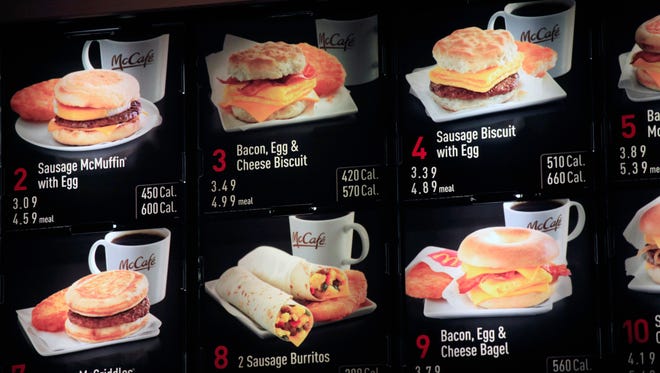 Breakfast menu, including the calories, are posted at a McDonald's restaurant in New York.