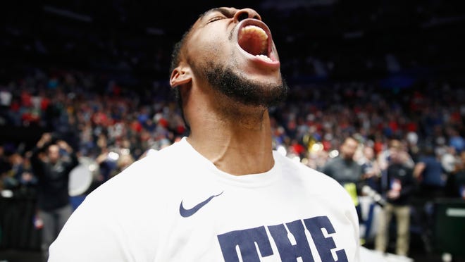 NASHVILLE, TN - MARCH 18:  A Nevada Wolf Pack player reacts after defeating the Cincinnati Bearcats in the second round of the 2018 Men's NCAA Basketball Tournament at Bridgestone Arena on March 18, 2018 in Nashville, Tennessee.  (Photo by Andy Lyons/Getty Images) ORG XMIT: 775103386 ORIG FILE ID: 933833198