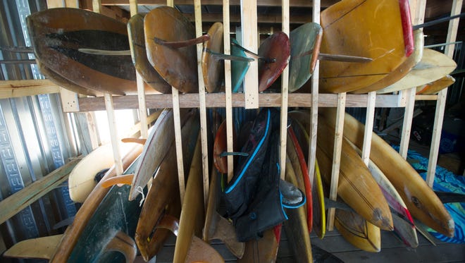 Charles Williams owns a collection of vintage surfboards, dating back to the early 1950s. After observing a neighbor who made surfboards, Williams began making his own in the mid-1970s. "There's only one way to not make it and that's to quit. I just won't quit," Williams said. 