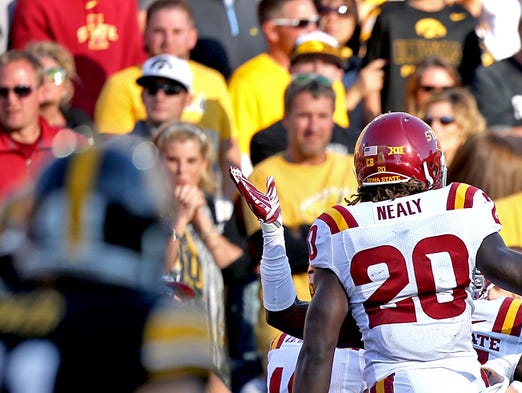 Iowa State's #20 DeVondrick Nealy, center, celebrated with teammates after he scored his team's second touchdown against Iowa in football game played at Kinnick Stadium in Iowa City on Saturday Sept. 13, 2014.