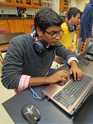 Omar Thenmalai, 17, a member of the Scarsdale High School's eSports Club sets his computer up to plays Dota 2 at Scarsdale High School.