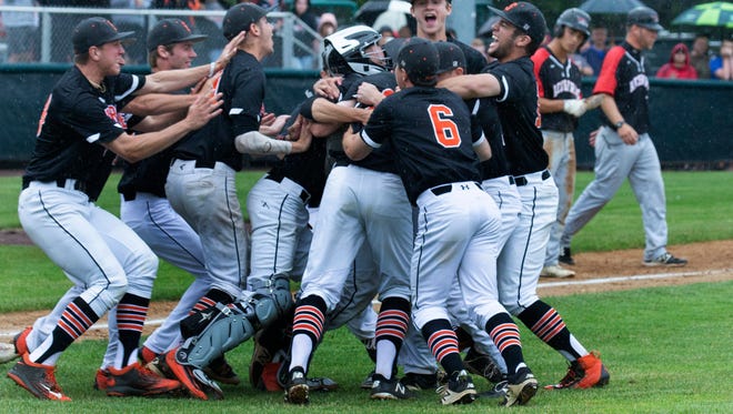 The Somerville High School baseball team celebrates its Group III championship over Allentown on Sunday.