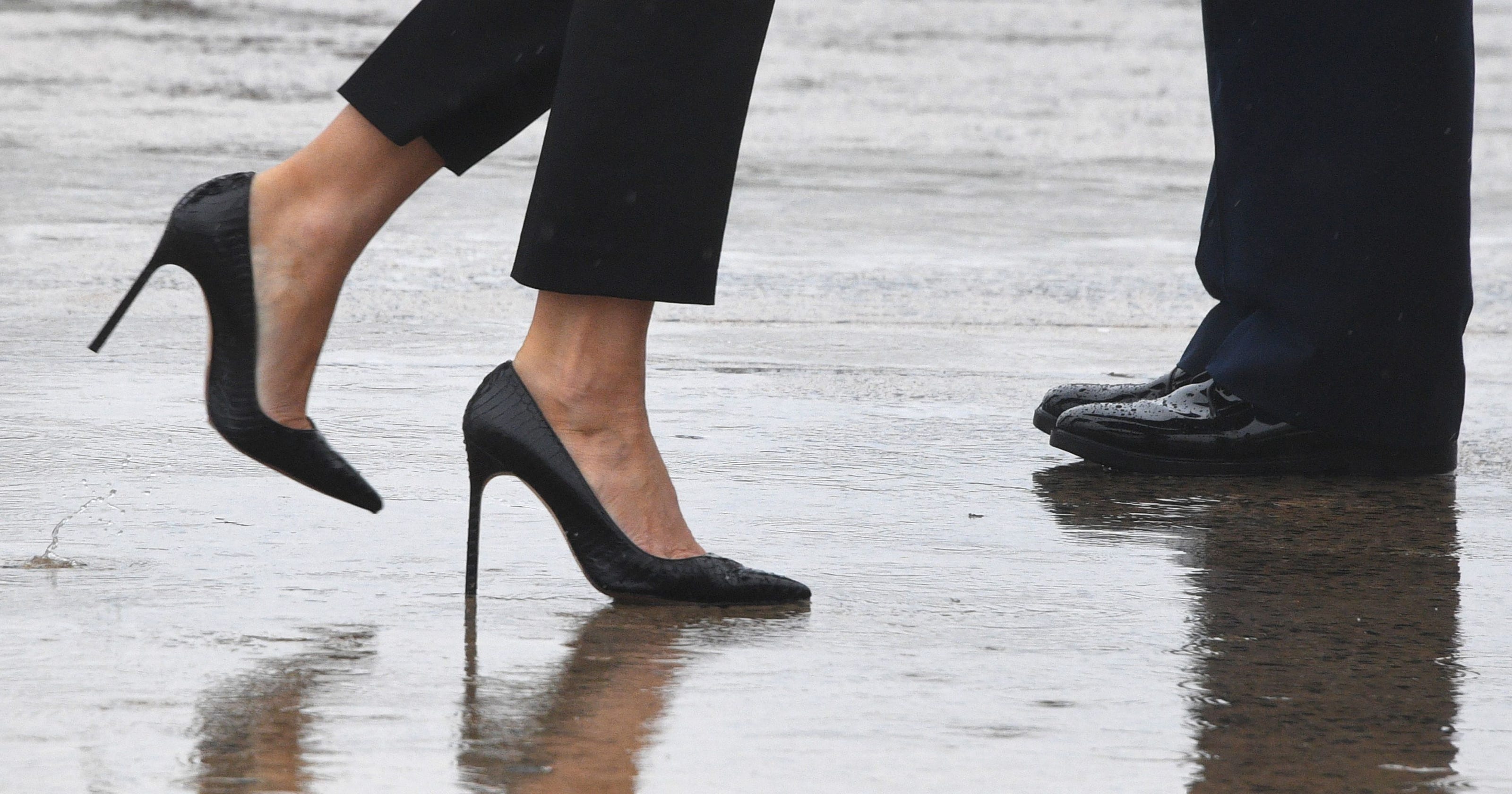 Melania Trump swaps stilettos for sneakers and a FLOTUS cap in flooded