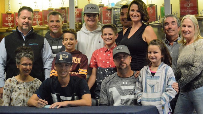 Piedra Vista's Alex Kuhn signed his letter of intent on Thursday to continue his baseball career at NCAA Division II Eastern New Mexico.
