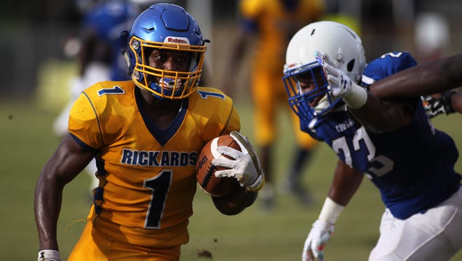 Rickards running back Destin Coates takes off for a gain against Godby during Friday’s spring jamboree at Gene Cox Stadium.
