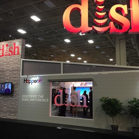 Booth at convention center with DISH setup, includ