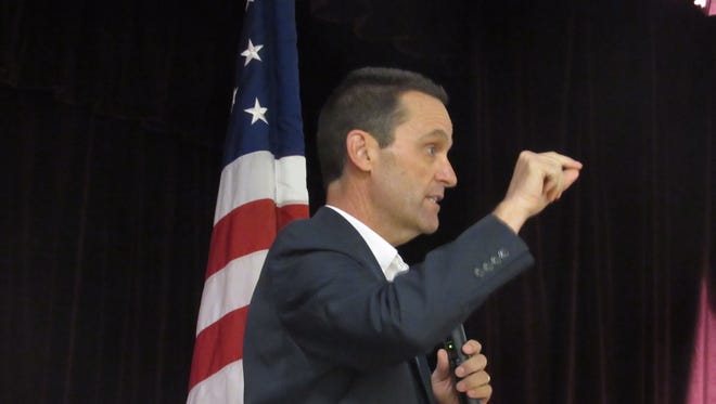 U.S. Rep. Steve Knight, R-Lancaster, answers a question at a March town hall meeting that was loud but peaceful. A similar event will be held Tuesday in Simi Valley.