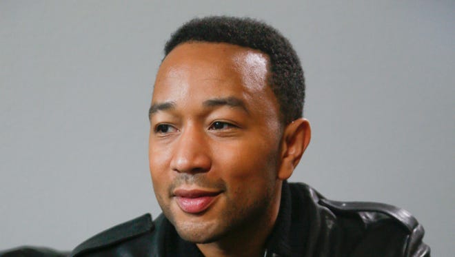 John Legend poses for a photograph during the SXSW Music Festival on Saturday, March 21, 2015, in Austin, Texas.