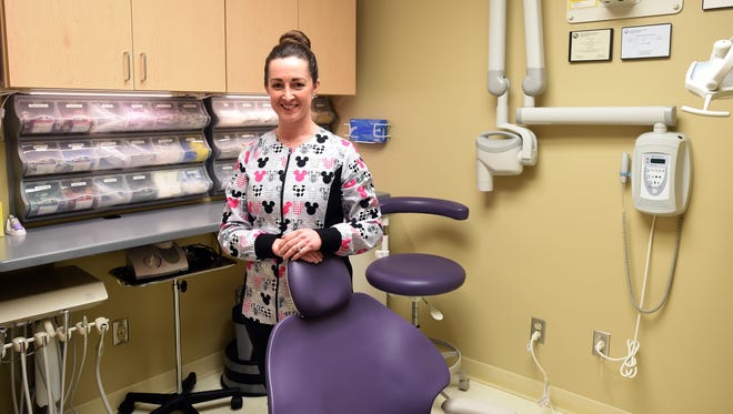 Lisa Markley is the dental hygienist for the new dental clinic at the Wayne County Health Department. Markley, who posed in the new exam room Wednesday, March 29, 2017, helped the clinic obtain a grant and setup the new dental area at the Richmond clinic.