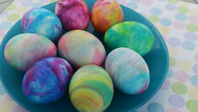 Rolling hard-boiled eggs through shaving cream and a few drops of liquid food coloring can create a tie-dyed effect.