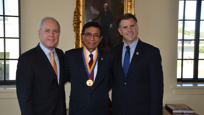 From left, Marist College President Dennis J. Murray, Marist Chemistry Instructor  Maung Htoo, Ph.D., and State Sen. Terry Gipson