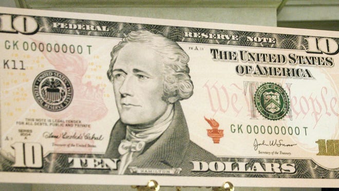 In 2006: An enlarged print of the redesigned $10 bill is displayed at the rotunda of the National Archives March 2, 2006 in Washington, DC.