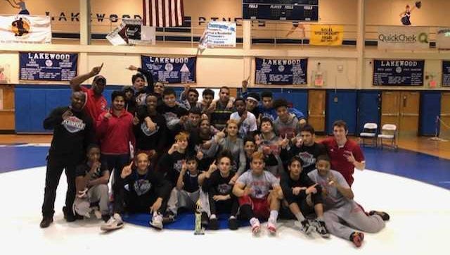 The Plainfield High School wrestling team celebrates after winning the 2018 New Jersey Urban Wrestling League tournament championship.