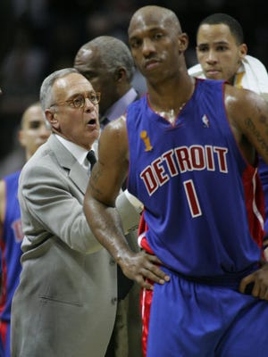 Detroit Pistons head coach Larry Brown talks to the team with Chauncey Billups during the 2005 NBA finals June 12, 2005 at the SBC Center in San Antonio, Texas.