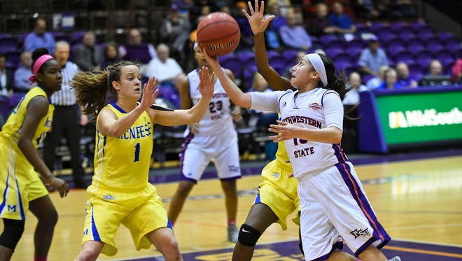 Janelle Perez goes up for a shot against McNeese State.