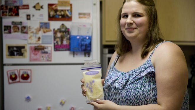 Rachel Palencik holds her frozen breast milk last month in West Chester, Pa. Palencik wants to be sure that her milk goes to a mom and infant who need it.