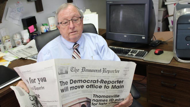 In this photo from Advertiser archives, Democrat-Reporter Publisher Goodloe Sutton reviews an article in 2015 about the paper moving to a new location.