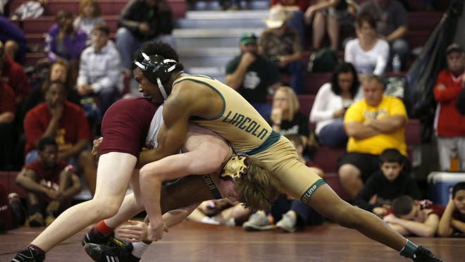 Lincoln’s David Jackson and Florida High’s Jake Richardson wrestle in the 145-pound weight class during the Seminole Classic last weekend.
