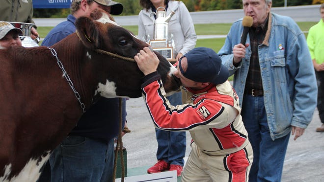 Barre’s Nick Sweet plants the winning kiss on the nose of “Velveeta” — the Vermont Milk Bowl trophy queen — after scoring the victory at Thunder Road on Sunday.