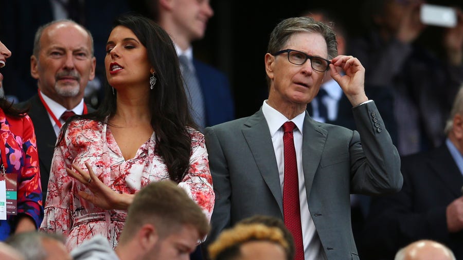 Liverpool owner John W Henry, right, watches his team during the English Premier League soccer match between Liverpool and Norwich City at Anfield in Liverpool, England, Friday, Aug. 9, 2019. (AP Photo/Dave Thompson)