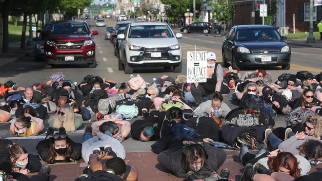 Protesters block traffic on Tuscarawas Street West following the Stark County Peace Rally for Justice in Canton on Monday, June 1, 2020.
