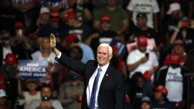Vice President Mike Pence waves to the crowd during a campaign rally in Tulsa, Okla., Saturday, June 20, 2020.