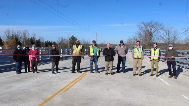 On Nov. 12, a ribbon cutting ceremony was done at the newly finished Black River Bridge project on Black River Road. The Cheboygan County Road Commission, Huron Pines and residents in the area were happy to have the structure back open. Photo by Kortny Hahn