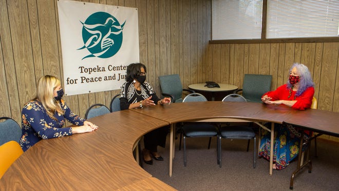From left, Lindsey Anderson, program director for the Topeka Center for Peace and Justice; Glenda DuBoise, the center's executive director; and Barbara Ballentine, its office and fiscal coordinator, hold discussions and meetings out of their office at 2914 S.W. MacVicar Ave.