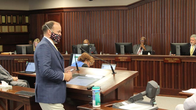 Davenport & Co. Senior Vice President Courtney Rogers addresses the Chatham County Commission on Friday, July 24.